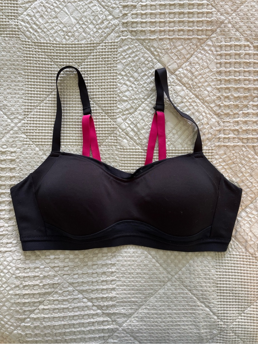 Moving Comfort Black Sports Bra with Pink Strap Accents.